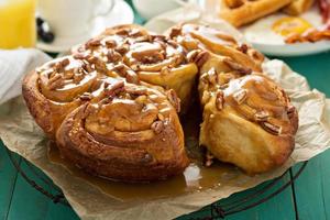 Sticky pecan buns on breakfast table photo