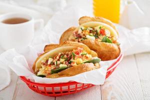 Croissant sandwich with egg salad and spinach photo