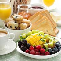 Fresh and bright continental breakfast table photo