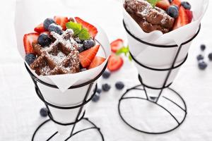 Small chocolate waffles in cones photo