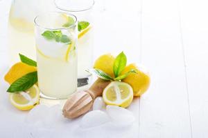 Fresh homemade lemonade in tall glasses photo