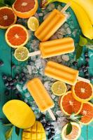 Mango banana popsicles on ice photo