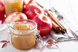 Homemade apple butter in glass jars photo