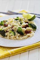 Pasta with broccoli and dried tomatoes photo