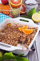 Orange and apple crumble with oats photo