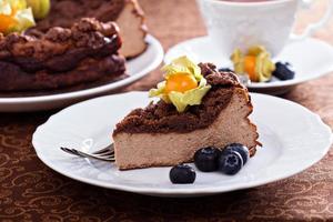 Chocolate cheesecake with crumb topping photo