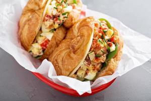 Croissant sandwich with egg salad and spinach photo