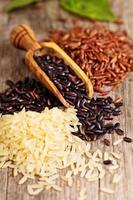 Variety of rice on a wooden background photo