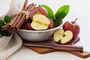 Fresh apples cut in a bowl photo