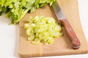 Celery on a cutting board photo