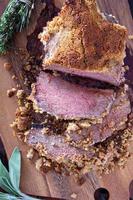 Roasted beef with herbed bread crust photo