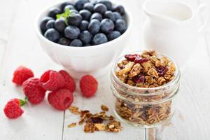 Homemade granola in a glass jar photo