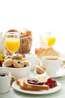 Fresh and bright continental breakfast table photo