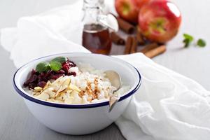 Breakfast rice porridge with almonds and cranberry photo