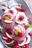 Raspberry and peach smoothie photo