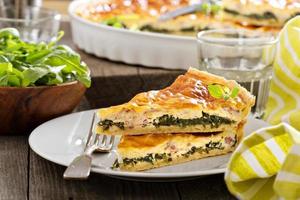 Quiche with arugula and bacon photo