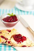 Freshly baked scones with orange zest and berries photo