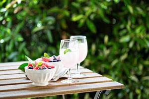 Cold watermelon drink on the table outdoors photo