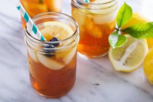 Ice tea with lemon and blueberry photo