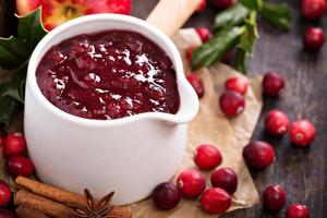 Cranberry sauce in ceramic saucepan photo