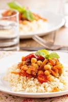 Cous-cous with chickpea and vegetable stew photo