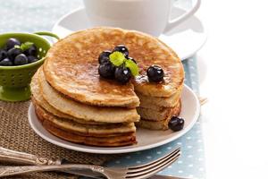 Stacked pancakes with berries photo