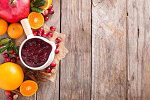 Cranberry sauce in ceramic saucepan photo