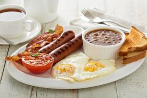 Full english breakfast with egg and bacon photo