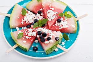 Fresh watermelon popsicles with blueberries photo