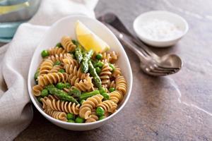 Whole wheat pasta with peas and asparagus photo