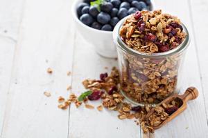 Homemade granola in a glass jar photo