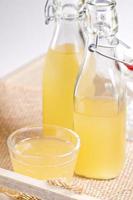 Homemade ginger ale in two glass bottles photo