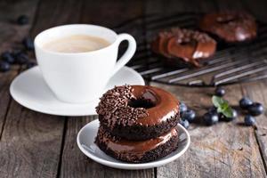 Chocolate donuts with coffee and blueberries photo