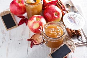 Homemade apple butter in glass jars photo