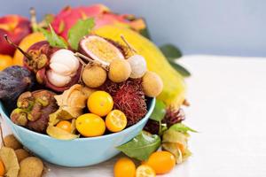 Exotic fruits in a blue bowl photo