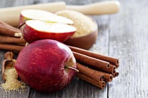 Baking a pie with apples, sugar and cinnamon photo