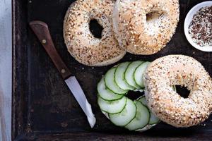 Everything bagels with cream cheese and cucumber photo