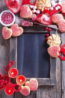 Valentines day cookies around a chalkboard photo