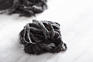 Squid ink homemade pasta on marble photo