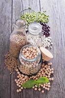 Raw beans and lentils in jars photo