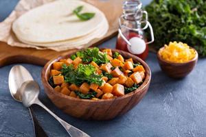 Making quesadillas with kale and sweet potato photo