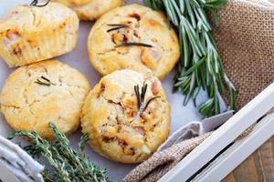 Savory muffins with herbs, tomatoes and ham photo