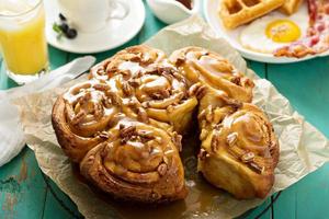 Sticky pecan buns on breakfast table photo