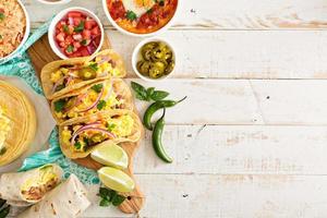 Variety of mexican cuisine dishes on a table photo