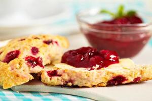 Freshly baked scones with orange zest and berries photo