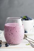 Blueberry banana smoothie in a glass photo