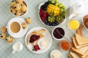Fresh and bright continental breakfast table photo