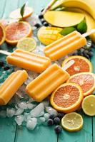 Mango banana popsicles on ice photo