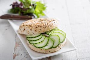 Everything bagels with cream cheese and cucumber photo