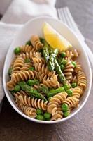 Whole wheat pasta with peas and asparagus photo